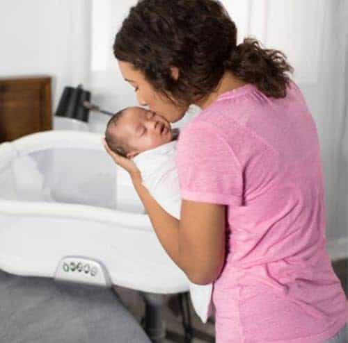 halo bassinest swivel sleeper bassinet safety mom holding the baby » Getforbaby