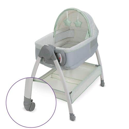 moving Graco Dream Suite Bassinet on wheels