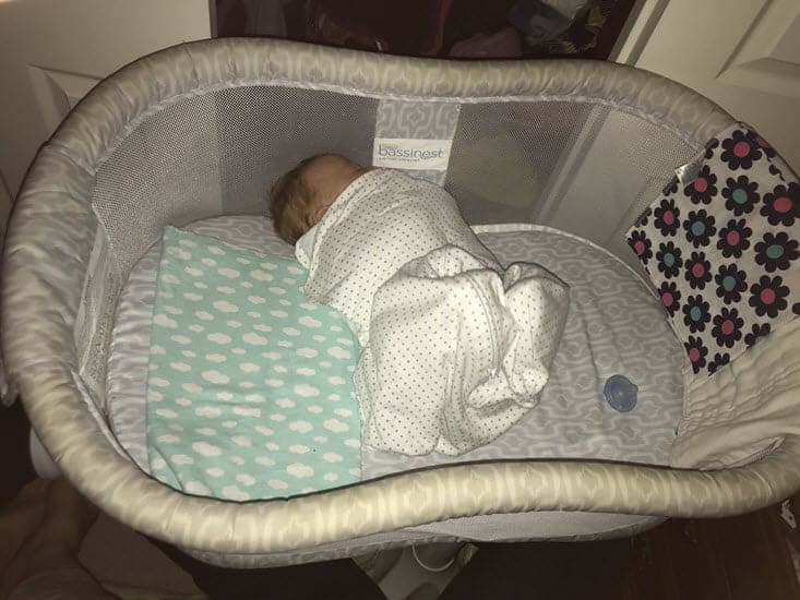 How to keep newborn from rolling store over in bassinet