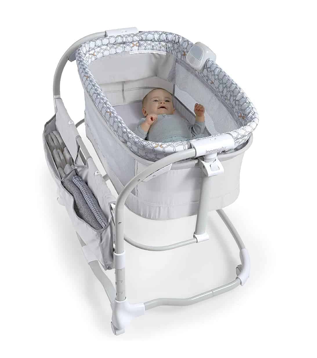 Baby sleeping in Ingenuity Dream and Grow Bedside Bassinet